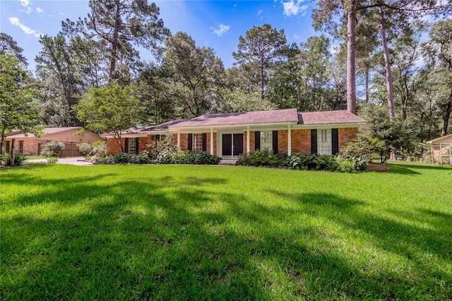 3799 Summer Ln, Huntsville, TX 77340 - single story home with a front yard and brick siding