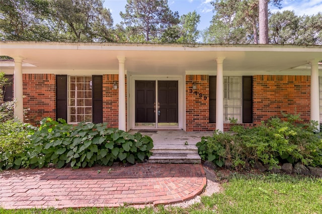 3799 Summer Ln, Huntsville, TX 77340 - doorway to property with covered porch and brick siding