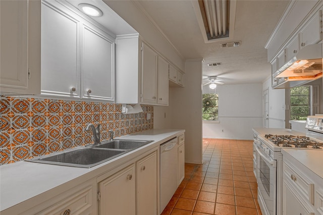 3799 Summer Ln, Huntsville, TX 77340 - kitchen featuring white appliances, under cabinet range hood, plenty of natural light, and light countertops