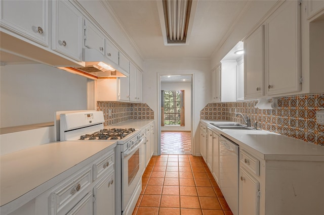 3799 Summer Ln, Huntsville, TX 77340 - kitchen with white appliances, light countertops, backsplash, light tile patterned floors, and ornamental molding