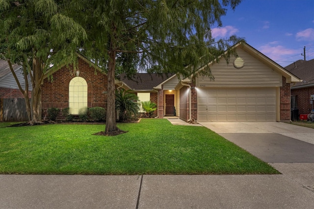 14306 Cypress Meadow Dr, Cypress, TX 77429 - single story home with brick siding, driveway, a front lawn, and an attached garage