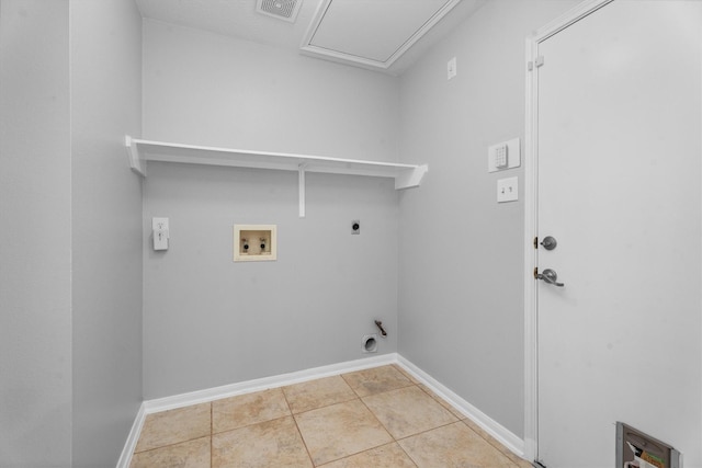 14306 Cypress Meadow Dr, Cypress, TX 77429 - laundry room featuring hookup for a washing machine, electric dryer hookup, and tile patterned floors