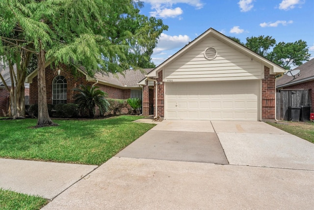 14306 Cypress Meadow Dr, Cypress, TX 77429 - ranch-style home with driveway, brick siding, a front yard, and an attached garage