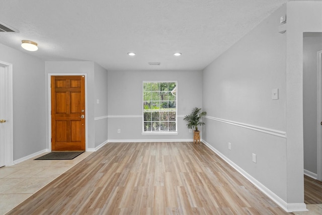 14306 Cypress Meadow Dr, Cypress, TX 77429 - entryway with wood finished floors, recessed lighting, and a textured ceiling