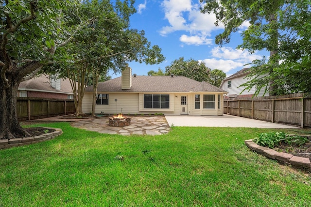 14306 Cypress Meadow Dr, Cypress, TX 77429 - back of property featuring a fire pit, a patio area, a fenced backyard, and a chimney
