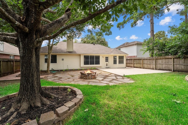 14306 Cypress Meadow Dr, Cypress, TX 77429 - rear view of house featuring a fire pit, a patio area, a fenced backyard, and a chimney