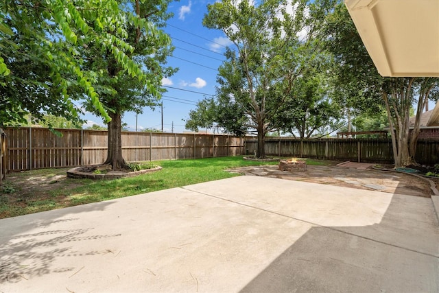 14306 Cypress Meadow Dr, Cypress, TX 77429 - fenced backyard featuring a patio area and an outdoor fire pit
