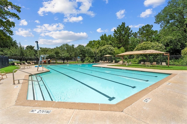14306 Cypress Meadow Dr, Cypress, TX 77429 - community pool featuring a patio area and view of scattered trees