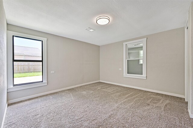 2131 6th Ave N, Texas City, TX 77590 - carpeted empty room featuring a textured ceiling and baseboards