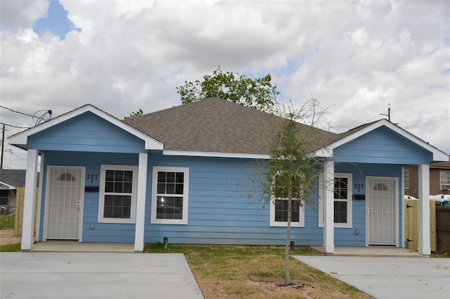 327 Delaware St Unit A, Houston, TX 77029 - view of front facade with covered porch and a shingled roof