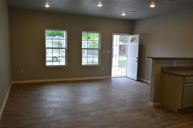 327 Delaware St Unit A, Houston, TX 77029 - interior space with dark wood finished floors and recessed lighting