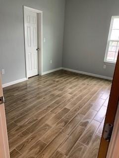 327 Delaware St Unit A, Houston, TX 77029 - unfurnished room featuring dark wood finished floors and baseboards