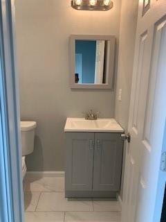 327 Delaware St Unit A, Houston, TX 77029 - half bathroom with vanity and tile patterned floors
