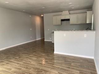327 Delaware St Unit A, Houston, TX 77029 - kitchen with wood finished floors and white cabinetry