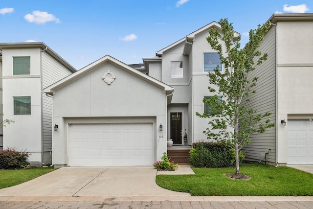 406 Yale Oaks Ln, Houston, TX 77091 - view of front of home featuring concrete driveway, stucco siding, an attached garage, and a front yard