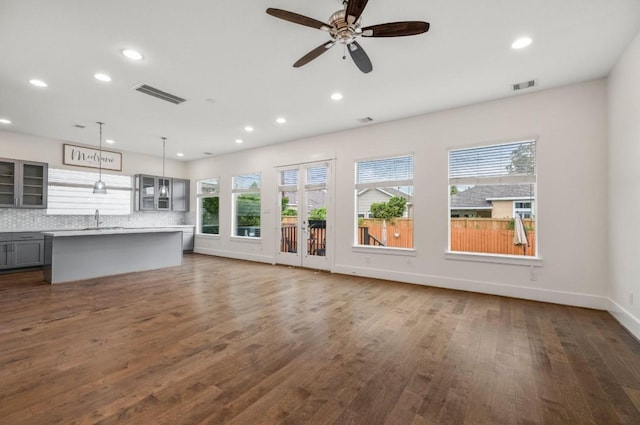 406 Yale Oaks Ln, Houston, TX 77091 - unfurnished living room featuring dark wood finished floors, recessed lighting, and a ceiling fan
