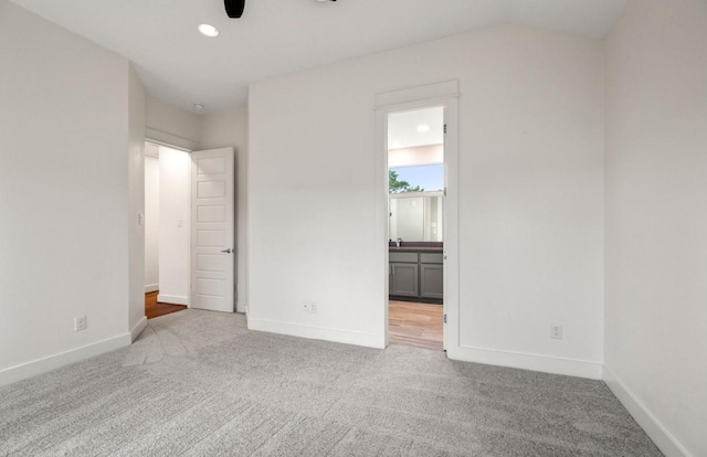 406 Yale Oaks Ln, Houston, TX 77091 - unfurnished bedroom with carpet floors, ensuite bathroom, recessed lighting, and lofted ceiling