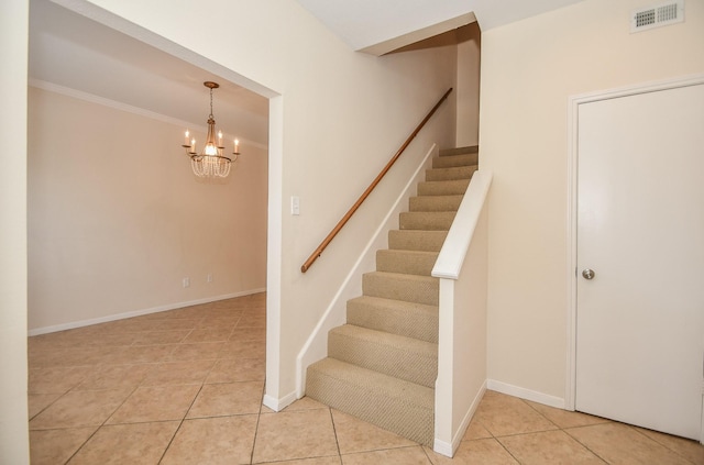 2100 Tanglewilde St Unit 169, Houston, TX 77063 - staircase featuring tile patterned floors, a chandelier, and crown molding