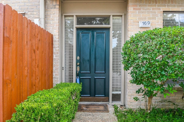 2100 Tanglewilde St Unit 169, Houston, TX 77063 - doorway to property featuring brick siding