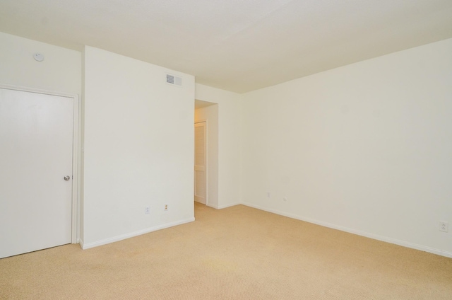 2100 Tanglewilde St Unit 169, Houston, TX 77063 - unfurnished bedroom featuring light colored carpet and baseboards