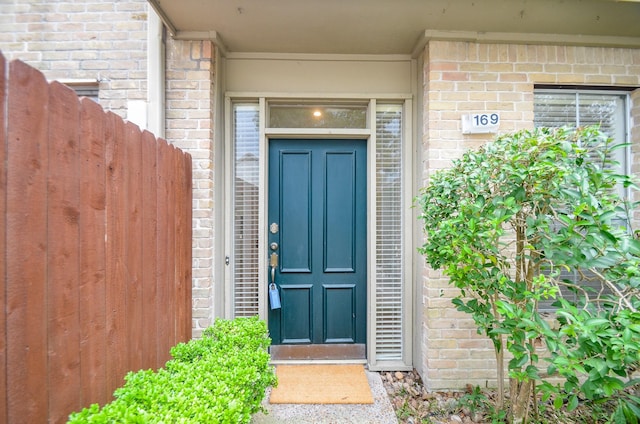 2100 Tanglewilde St Unit 169, Houston, TX 77063 - doorway to property featuring brick siding