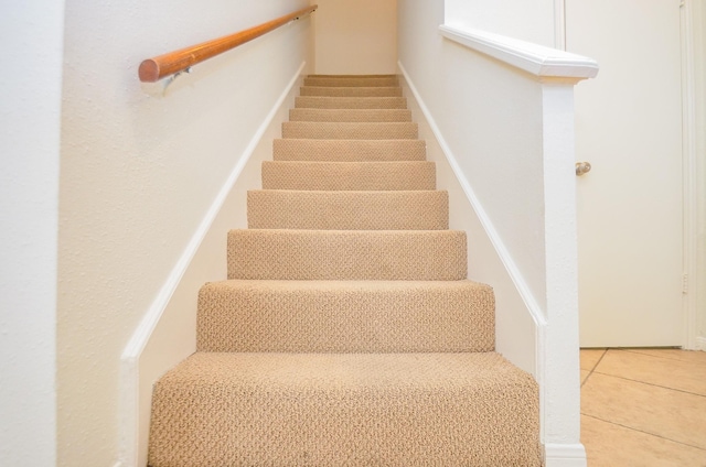 2100 Tanglewilde St Unit 169, Houston, TX 77063 - stairs featuring tile patterned flooring