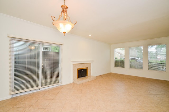 2100 Tanglewilde St Unit 169, Houston, TX 77063 - unfurnished living room with plenty of natural light, ornamental molding, a fireplace, and light tile patterned floors
