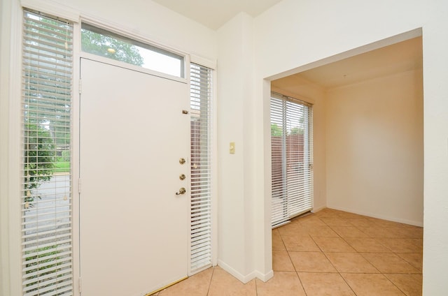 2100 Tanglewilde St Unit 169, Houston, TX 77063 - foyer featuring light tile patterned floors and baseboards