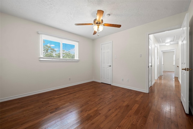 8114 Coolshire Ln, Houston, TX 77070 - unfurnished bedroom featuring attic access, hardwood / wood-style flooring, a textured ceiling, and ceiling fan