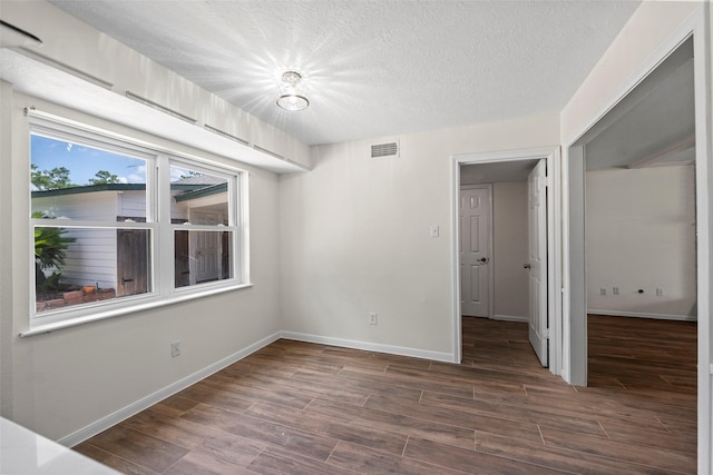 8114 Coolshire Ln, Houston, TX 77070 - unfurnished room featuring wood finished floors and a textured ceiling