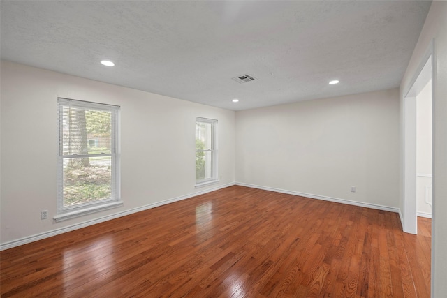 8114 Coolshire Ln, Houston, TX 77070 - empty room with wood finished floors and recessed lighting