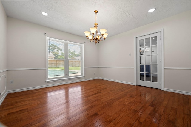8114 Coolshire Ln, Houston, TX 77070 - unfurnished room featuring a chandelier, a textured ceiling, wood finished floors, and recessed lighting