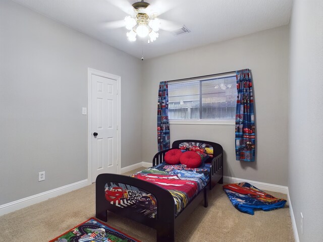 11614 Taos Ln, Houston, TX 77070 - carpeted bedroom featuring baseboards and ceiling fan