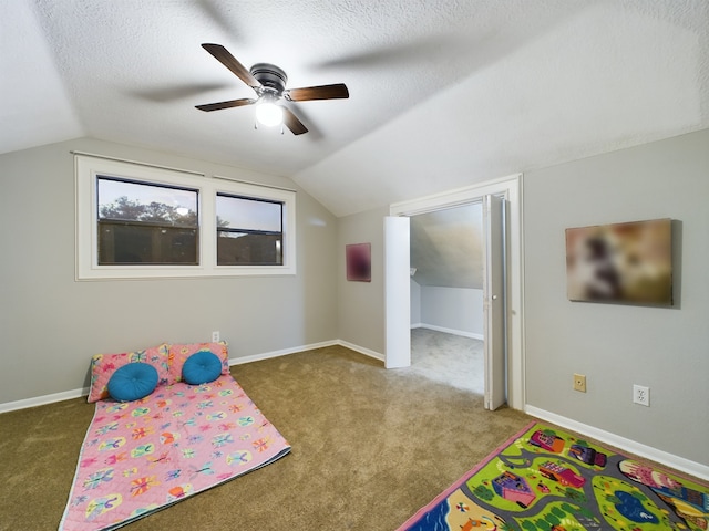 11614 Taos Ln, Houston, TX 77070 - unfurnished bedroom featuring carpet flooring, vaulted ceiling, ceiling fan, and a textured ceiling