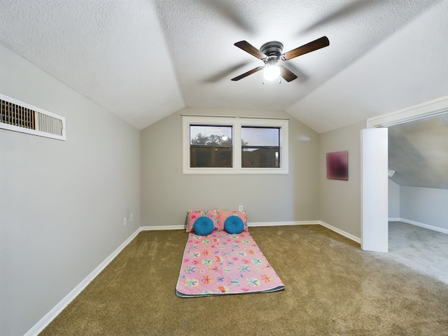 11614 Taos Ln, Houston, TX 77070 - playroom featuring carpet floors, lofted ceiling, ceiling fan, and a textured ceiling