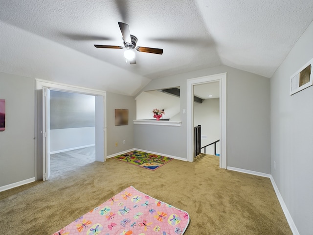 11614 Taos Ln, Houston, TX 77070 - rec room featuring carpet, vaulted ceiling, ceiling fan, and a textured ceiling