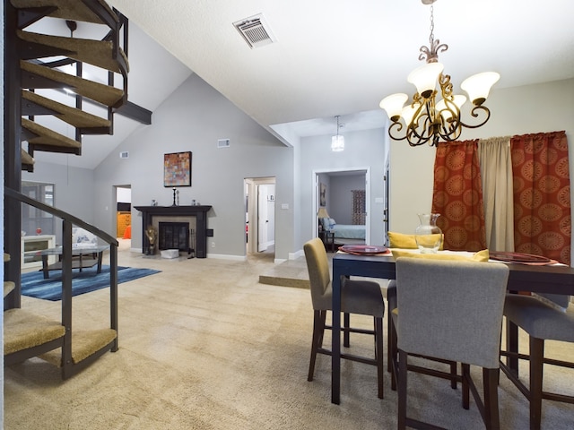 11614 Taos Ln, Houston, TX 77070 - carpeted dining space with a chandelier, high vaulted ceiling, stairs, and a fireplace with flush hearth