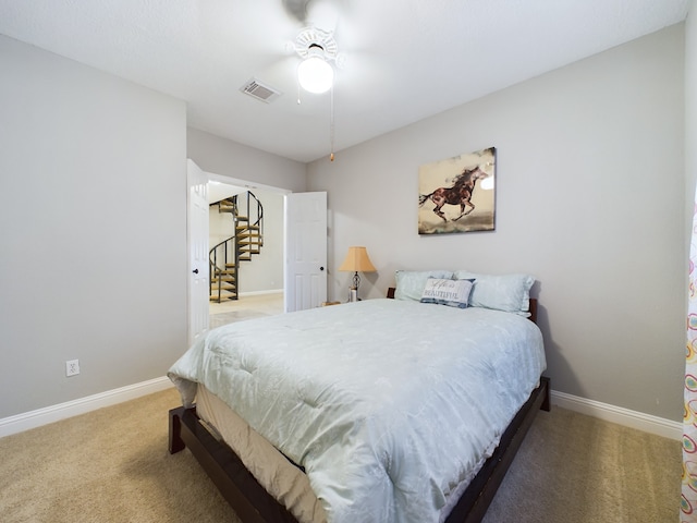 11614 Taos Ln, Houston, TX 77070 - carpeted bedroom with baseboards and ceiling fan