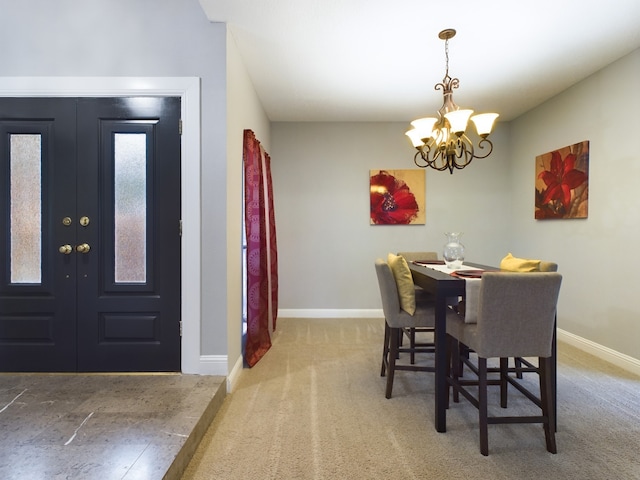 11614 Taos Ln, Houston, TX 77070 - dining room featuring a chandelier and carpet floors