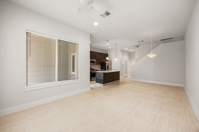 1907 Harlem St Unit A, Houston, TX 77020 - unfurnished living room featuring ceiling fan and recessed lighting