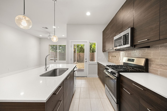 1907 Harlem St Unit A, Houston, TX 77020 - kitchen featuring appliances with stainless steel finishes, light countertops, backsplash, and recessed lighting
