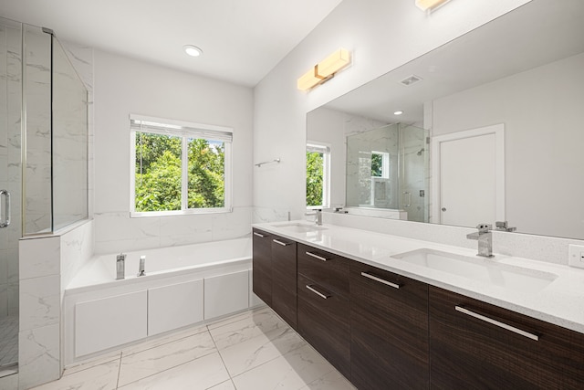 1907 Harlem St Unit A, Houston, TX 77020 - bathroom featuring a marble finish shower, double vanity, a bath, and marble finish flooring