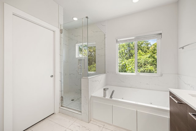 1907 Harlem St Unit A, Houston, TX 77020 - full bath with a whirlpool tub, marble finish floors, a marble finish shower, vanity, and recessed lighting