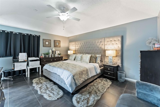 1710 Blue Heather Ln, Fresno, TX 77545 - bedroom featuring dark tile patterned flooring, ceiling fan, and a textured ceiling