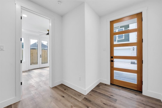 1805 Emir St Unit E, Houston, TX 77009 - foyer with wood finished floors, french doors, and ceiling fan