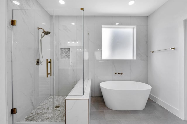 1805 Emir St Unit E, Houston, TX 77009 - bathroom featuring a soaking tub, a marble finish shower, recessed lighting, and tile patterned flooring