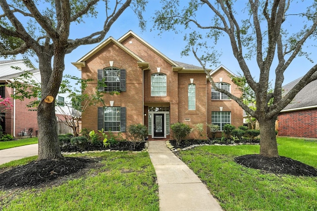 21306 Willowford Park Dr, Katy, TX 77450 - traditional home with brick siding and a front yard