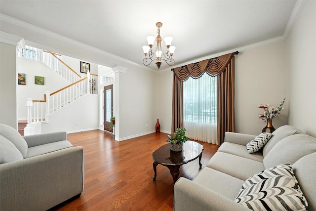 21306 Willowford Park Dr, Katy, TX 77450 - living area with healthy amount of natural light, a chandelier, ornamental molding, wood finished floors, and stairs