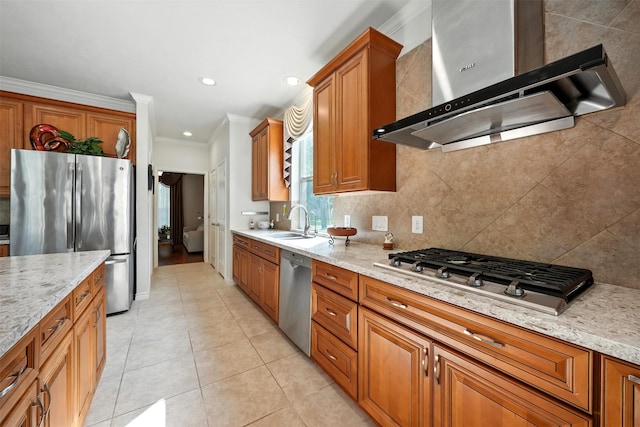 21306 Willowford Park Dr, Katy, TX 77450 - kitchen with wall chimney exhaust hood, stainless steel appliances, brown cabinets, light tile patterned floors, and crown molding