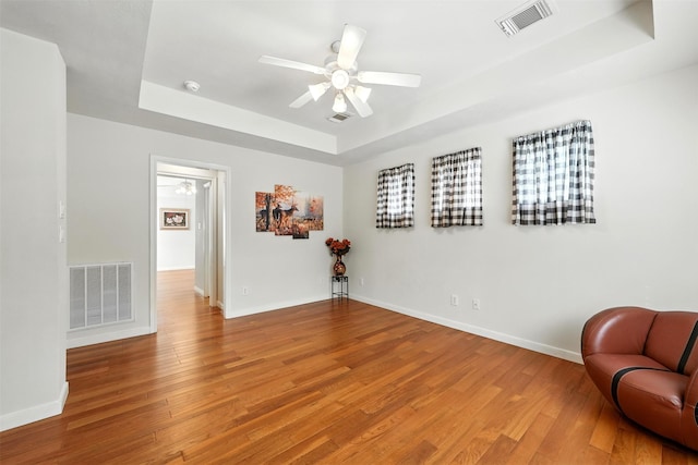 21306 Willowford Park Dr, Katy, TX 77450 - unfurnished room with a raised ceiling, light wood-style flooring, and ceiling fan